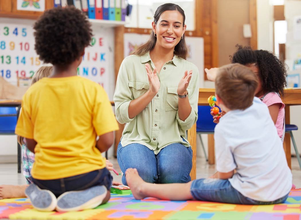 Enthusiastic teacher interacting with children.