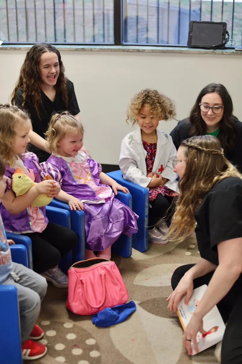 AB Spectrum team engaging children in a group activity